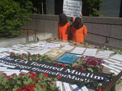 A demonstration takes place outside the Hart Building in Washington, D.C., in May 2018 during the confirmation hearing of former CIA director Gina Haspel.