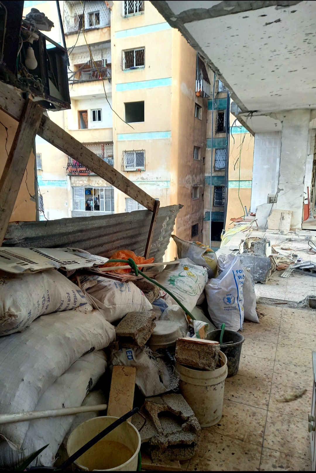 When I open the door, I see the apartment across from mine completely destroyed. How am I supposed to live surrounded by this danger? My mother trembles with fear every time we step outside, afraid we might be next.