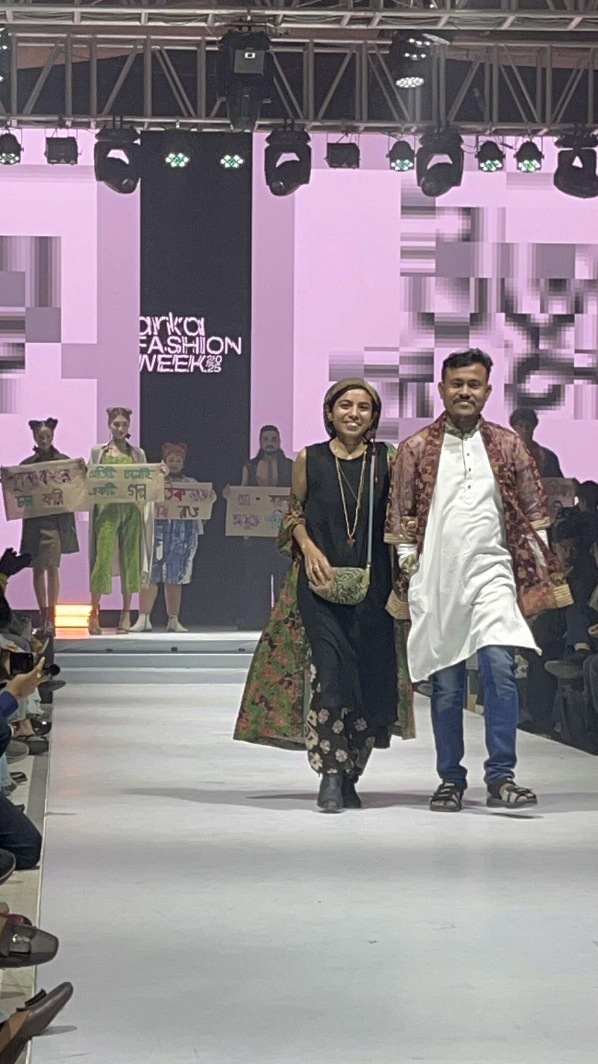 Tarannum Nibir Ali and Habib Bhai walk down the runway together at Arka Fashion Week in Dhaka in February 2025.