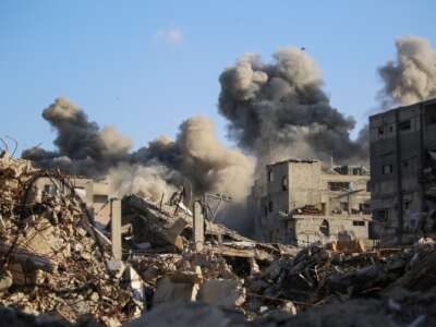 Smoke billows following an Israeli strike that targeted a building in the Bureij camp for Palestinian refugees in the central Gaza Strip on October 19, 2025.