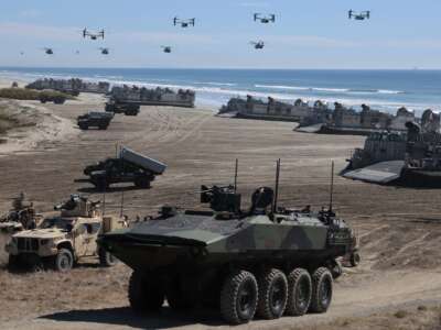 Navy Landing Craft Air Cushions unload equipment onto the beach as U.S. Marine Corps V-22 Ospreys and CH-53 Super Stallions fly overhead during the America's Marines 250 event at Camp Pendleton's Red Beach on October 18, 2025 in Oceanside, California. The U.S. Marines are marking their 250th anniversary with a live amphibious assault demonstration entitled "Sea To Shore--A Review of Amphibious Strength" and visits from Vice President JD Vance and War Secretary Pete Hegseth.