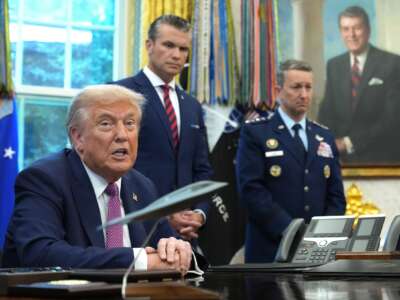 U.S. President Donald Trump speaks to be media prior to signing an executive order renaming the Department of Defense as the Department of War as U.S. Defense Secretary Pete Hegseth (C) and Chairman of the Joint Chiefs of Staff Air Force Gen. Dan Caine (R) look on on September 05, 2025 in Washington, DC.