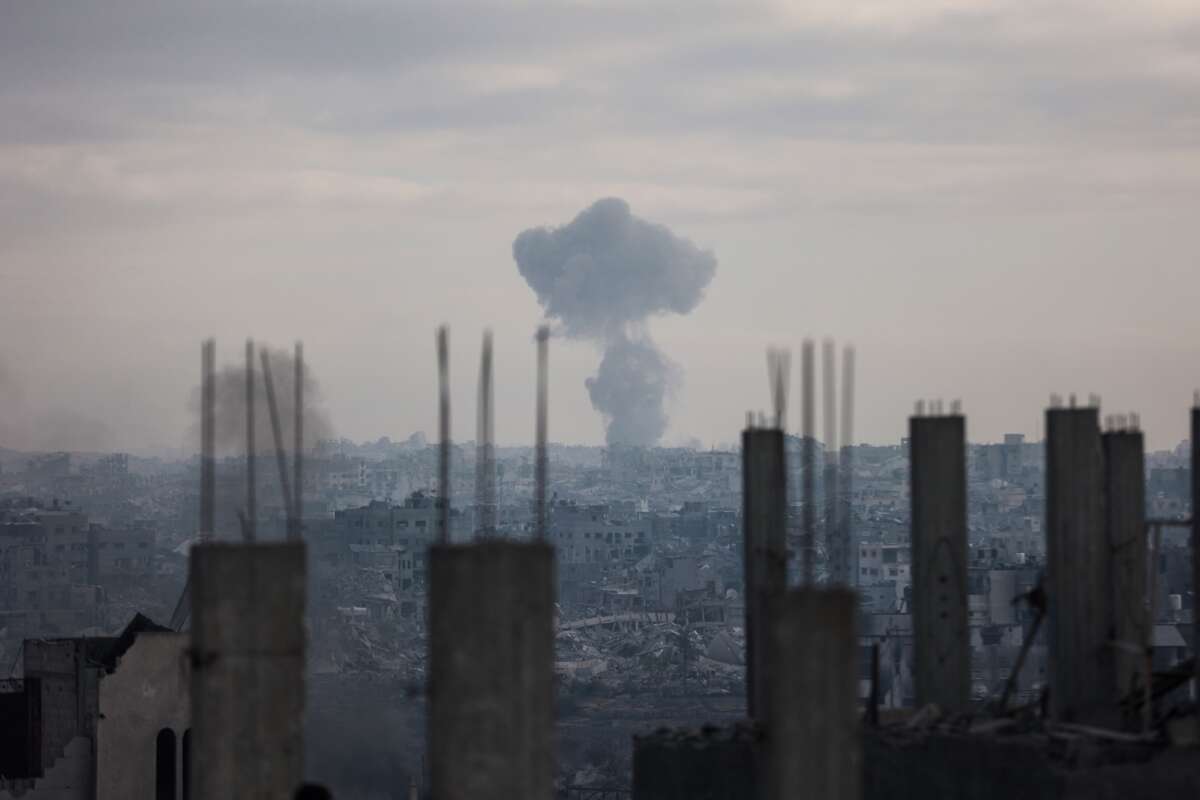 A plume of smoke billows following an Israeli strike in Gaza City on October 29, 2025.