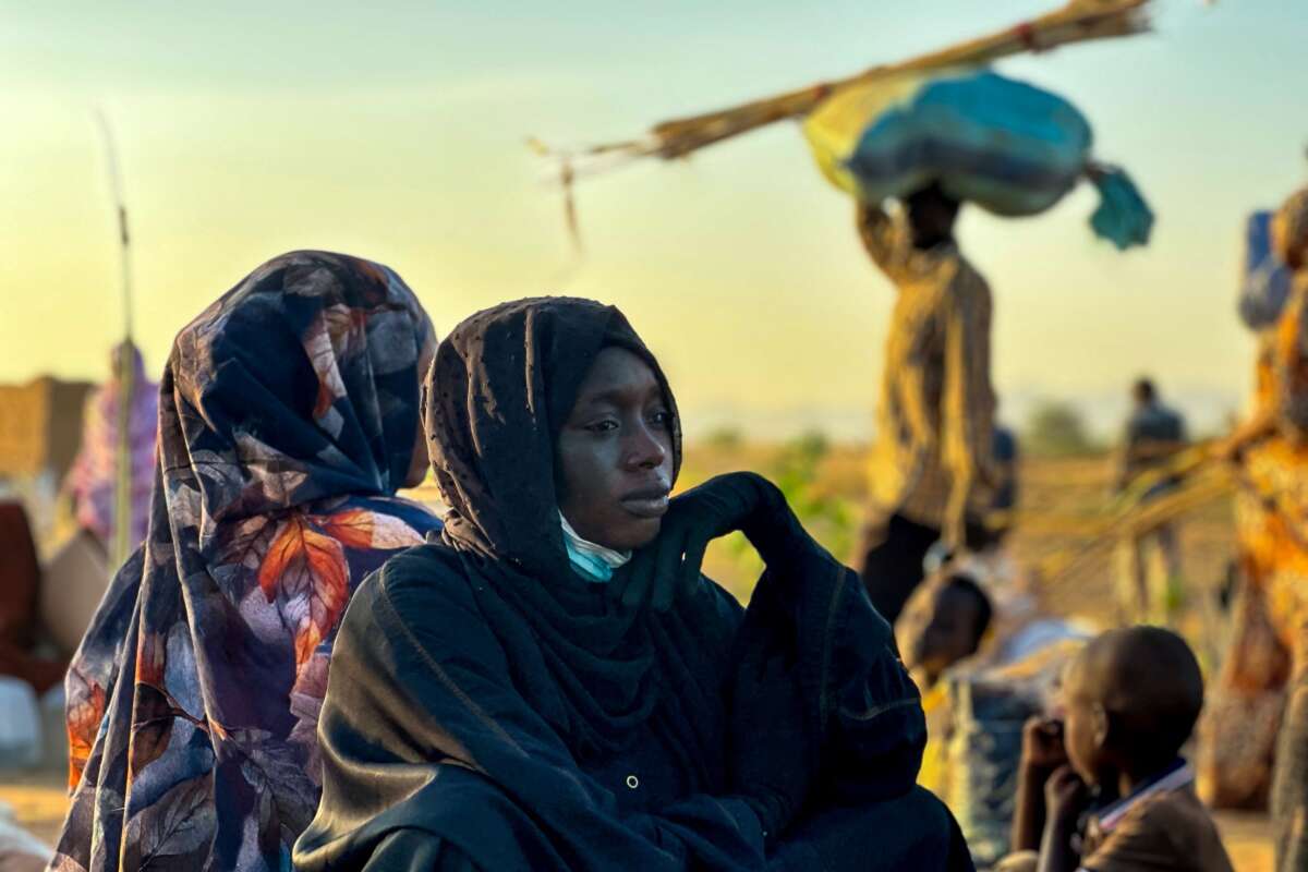A displaced woman rests in Tawila, in the country's war-torn western Darfur region, on October 28, 2025, after fleeing El-Fasher following the city’s fall to the Rapid Support Forces (RSF).