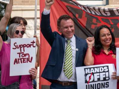 Tom Alter with his supporters at a press conference and rally in September.