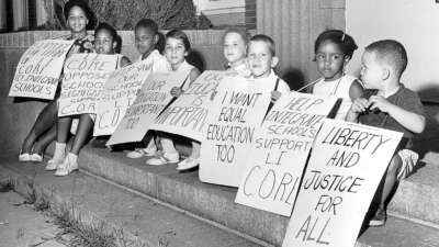 What conditions make it possible for people to enter into the lifelong and intergenerational work of unlearning racism? In this image, children rally in support of racially integrated schools in Malverne, New York, on August 2, 1962.