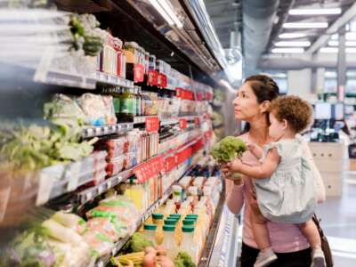 Baby in mom's arms at a grocery store