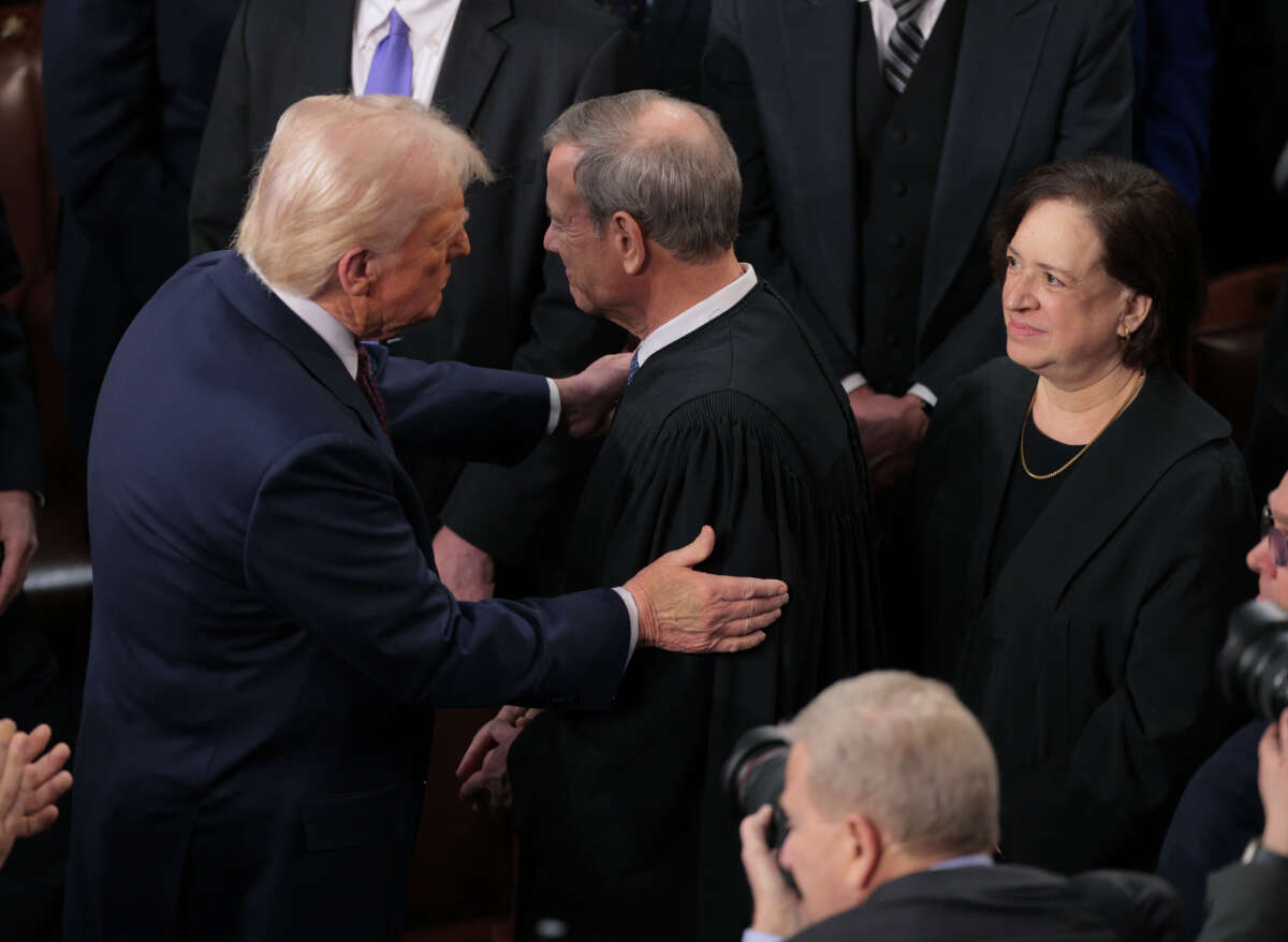 President Donald Trump greets Chief Supreme Court Justice John Roberts as he arrives to deliver an address to a joint session of Congress at the U.S. Capitol on March 4, 2025, in Washington, D.C.