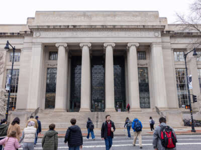 People walk in front of Massachusetts Institute of Technology's Building 7 on April 15, 2025, in Cambridge, Massachusetts.