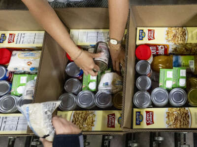 Workers pack boxes for the Commodity Supplemental Food Program at The Orange County Food Bank in Garden Grove, California, on May 9, 2025.