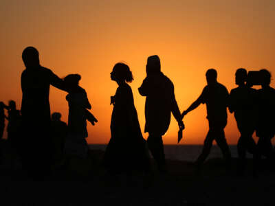 Displaced Palestinians move with their belongings southwards on a road in the Nuseirat refugee camp area in the central Gaza Strip on September 20, 2025, as Israel presses its ground offensive to capture Gaza City.