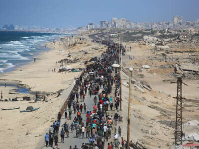 Palestinians make their way along Al-Rashid road toward Gaza City from Nuseirat in the central Gaza Strip, on October 10, 2025.