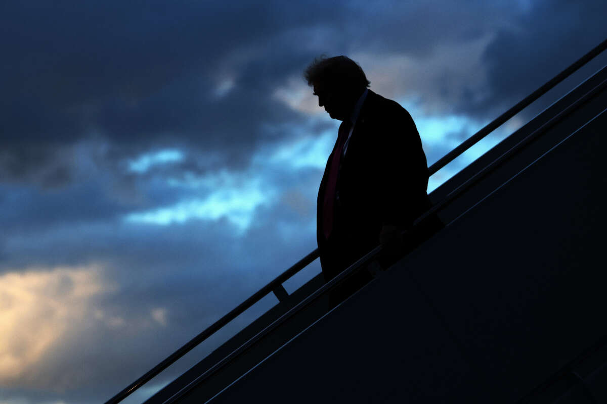 President Donald Trump walks down the steps of Air Force One after he landed at West Palm Beach International Airport on October 17, 2025, in West Palm Beach, Florida.