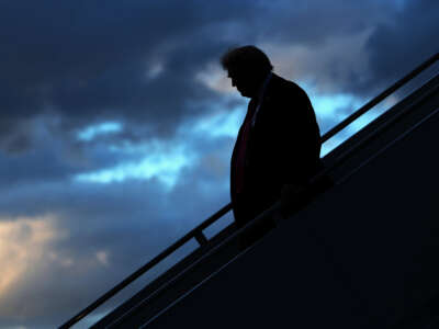President Donald Trump walks down the steps of Air Force One after he landed at West Palm Beach International Airport on October 17, 2025, in West Palm Beach, Florida.