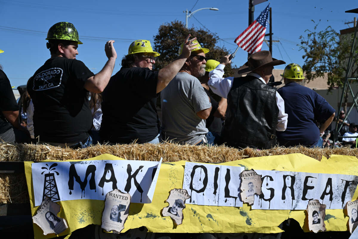 People ride a float during the Oildorado Grand Parade, themed "Make Oil Great Again," on October 18, 2025 in Taft, California, a town of about 7,000 residents built atop the Midway-Sunset Oil Field.