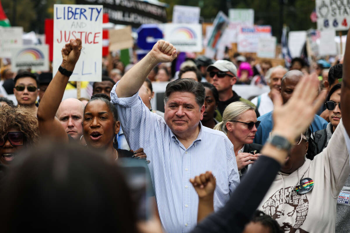 Illinois Governor JB Pritzker joins the demonstrators during the second "No Kings" protest on October 18, 2025, in Chicago, Illinois.