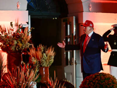 President Donald Trump gestures as he leaves a Halloween event at the White House in Washington, D.C., on October 30, 2025.