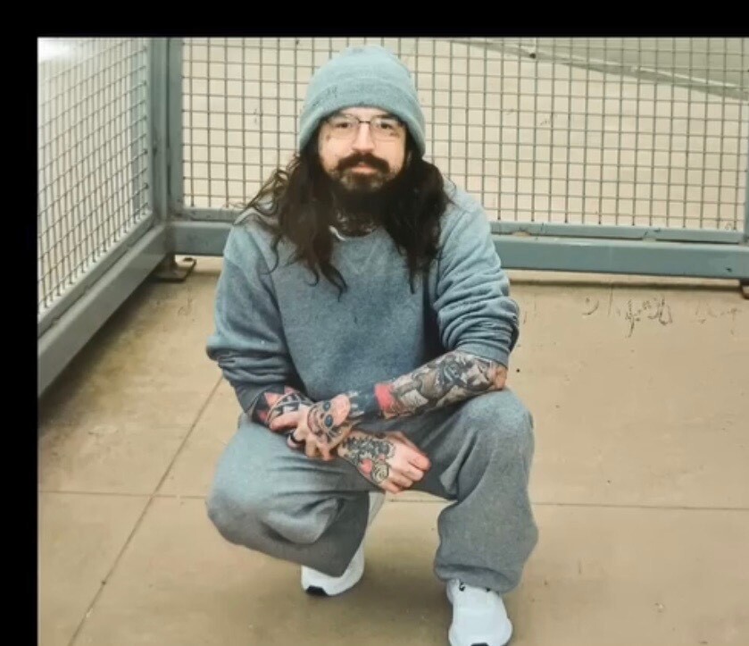 Eric King squats in the ADX Florence K-B Unit rec yard while incarcerated at the supermax prison in 2022.