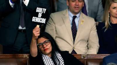 Rep. Rashida Tlaib (D-Michigan) holds a sign that reads "Guilty of Genocide" as Israeli Prime Minister Benjamin Netanyahu addresses a joint meeting of Congress in the chamber of the House of Representatives at the U.S. Capitol on July 24, 2024 in Washington, D.C.
