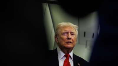 U.S. President Donald Trump speaks to reporters aboard Air Force One en route to the White House on November 2, 2025 after taking off from Palm Beach International Airport in West Palm Beach, Florida.
