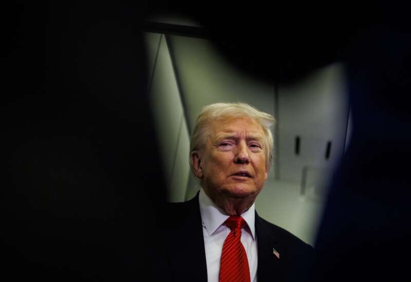 U.S. President Donald Trump speaks to reporters aboard Air Force One en route to the White House on November 2, 2025 after taking off from Palm Beach International Airport in West Palm Beach, Florida.