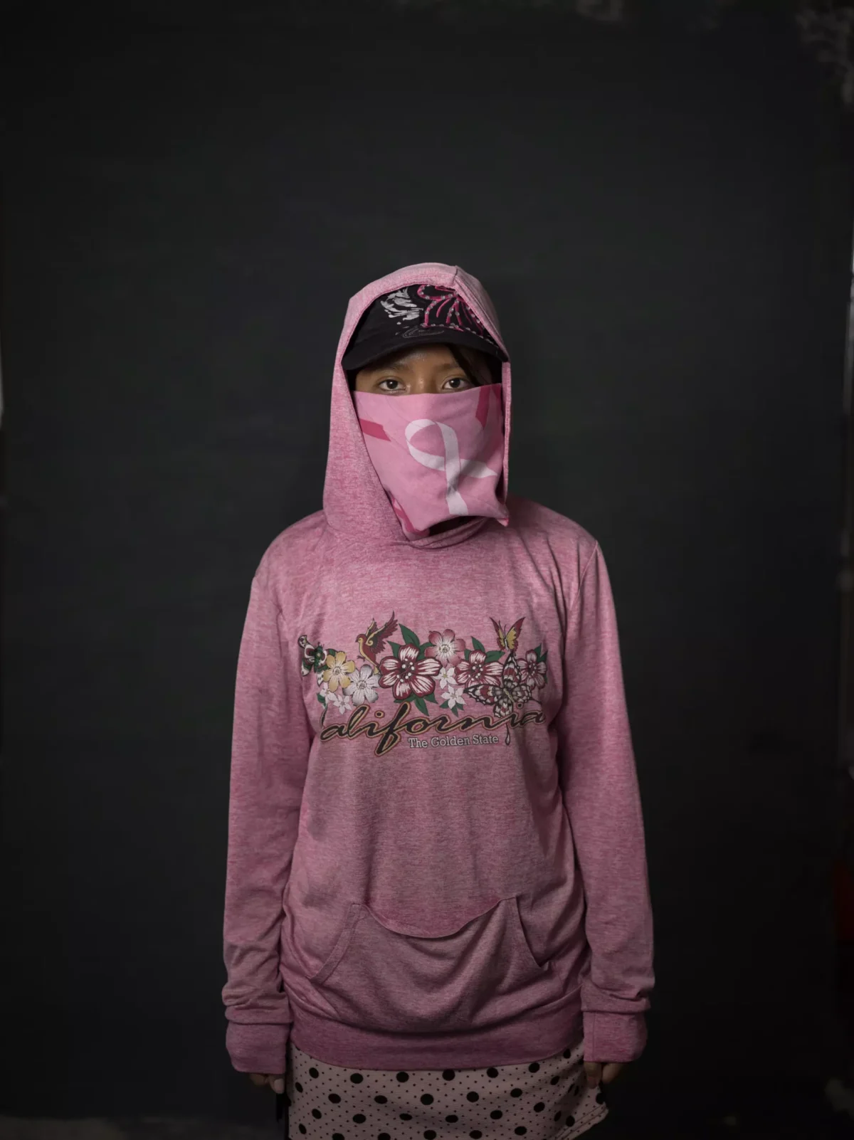 Angelica, seen at 15, picks tomatillos in the Santa Maria Valley. She started working in the fields when she was 11 years old. She says she gets paid $3 for each five-gallon bucket of tomatillos she fills. On a typical workday of about five or six hours, she says she can fill three buckets — earning just $9 for her labor. She described toiling in fields where employers failed to provide shade and drinking water.