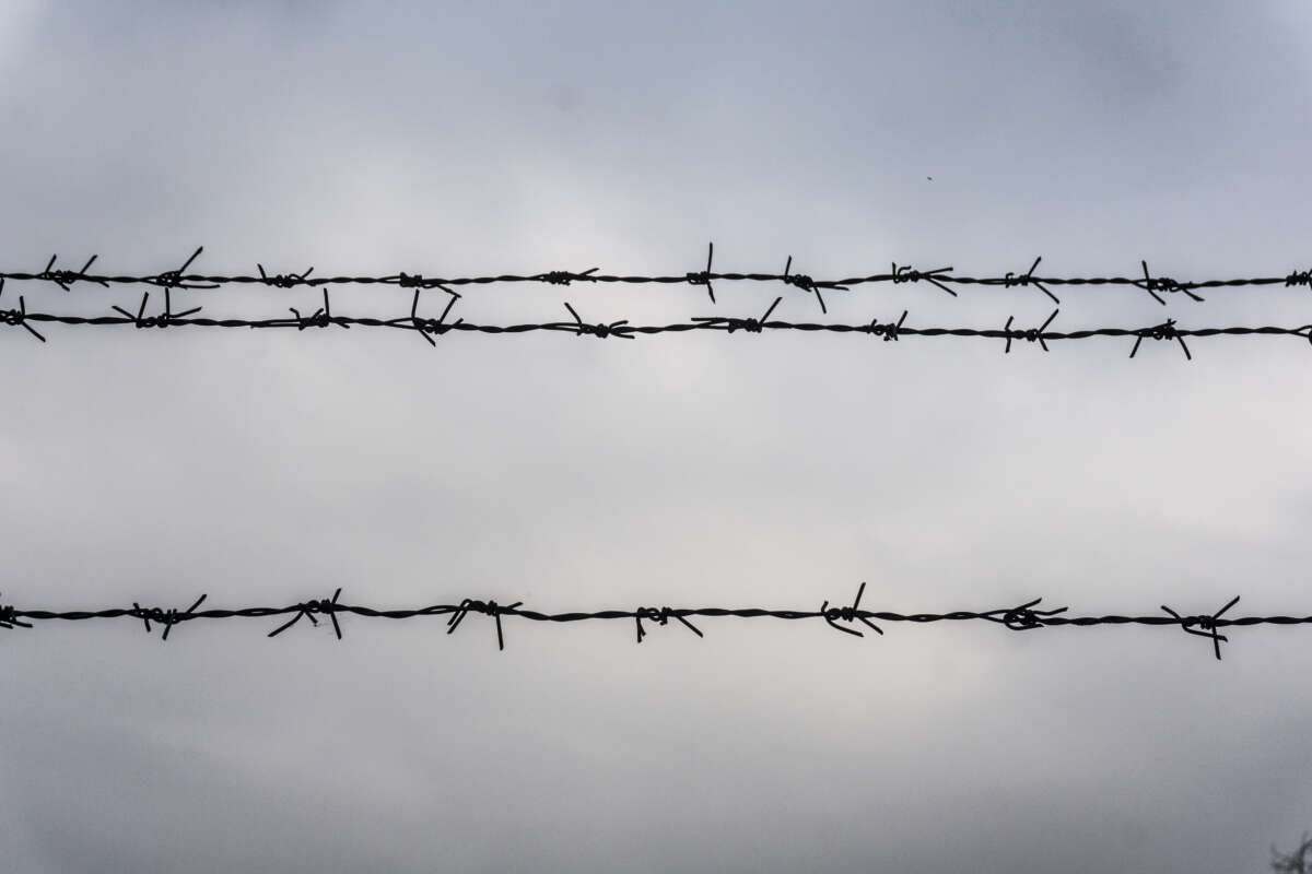 Barbed wire against sky.