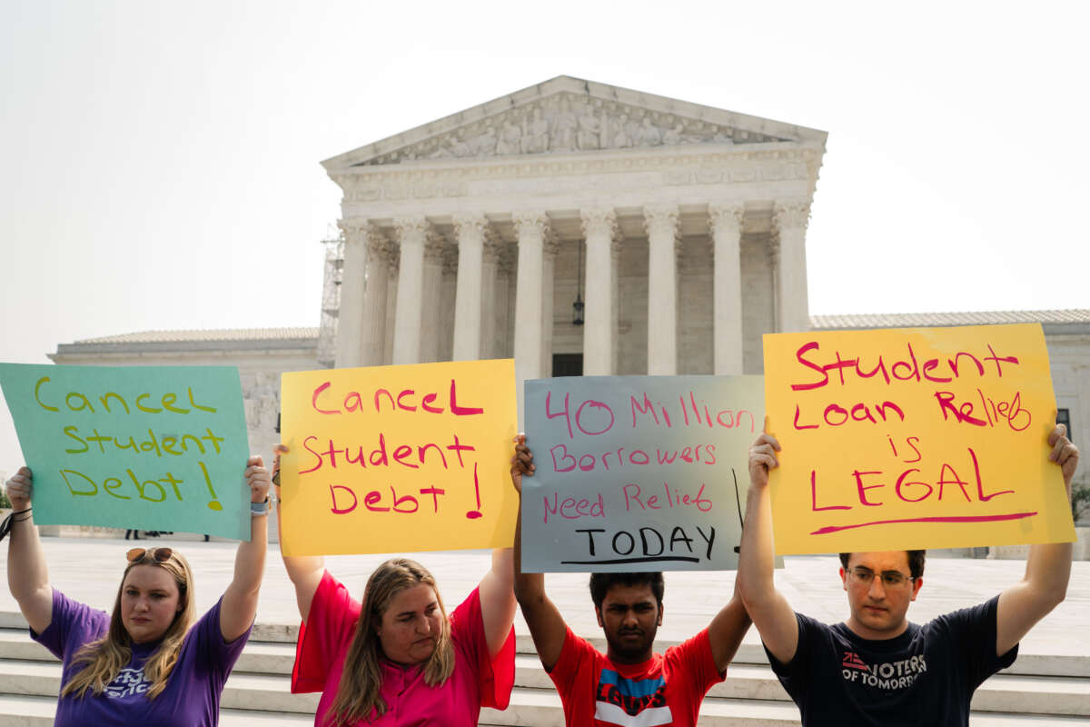 Student Debt relief advocates stand outside of the Supreme Court of the United States as they wait for the Supreme Court to release their opinion on wether or not to strike down President Biden's student debt relief program on Friday, June 30, 2023, in Washington, D.C.