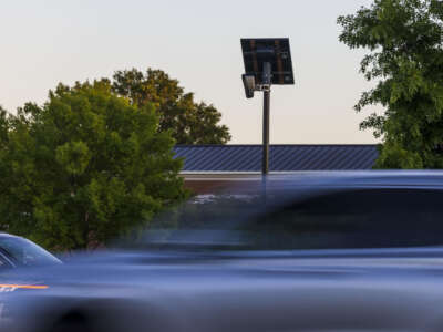 Cars drive by a Flock camera, an automated license plate reader, on East Little Creek Road in Norfolk, Virginia, on May 21, 2024.