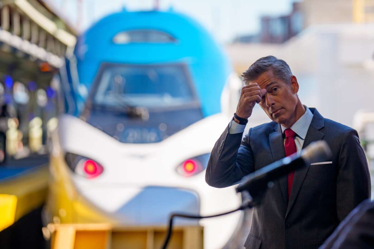 U.S. Transportation Secretary Sean Duffy stands near a NextGen Amtrak Acela train during a news conference for the train's first day of service along the Northeast Corridor on August 27, 2025, in Washington, D.C.