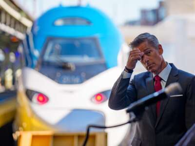 U.S. Transportation Secretary Sean Duffy stands near a NextGen Amtrak Acela train during a news conference for the train's first day of service along the Northeast Corridor on August 27, 2025, in Washington, D.C.
