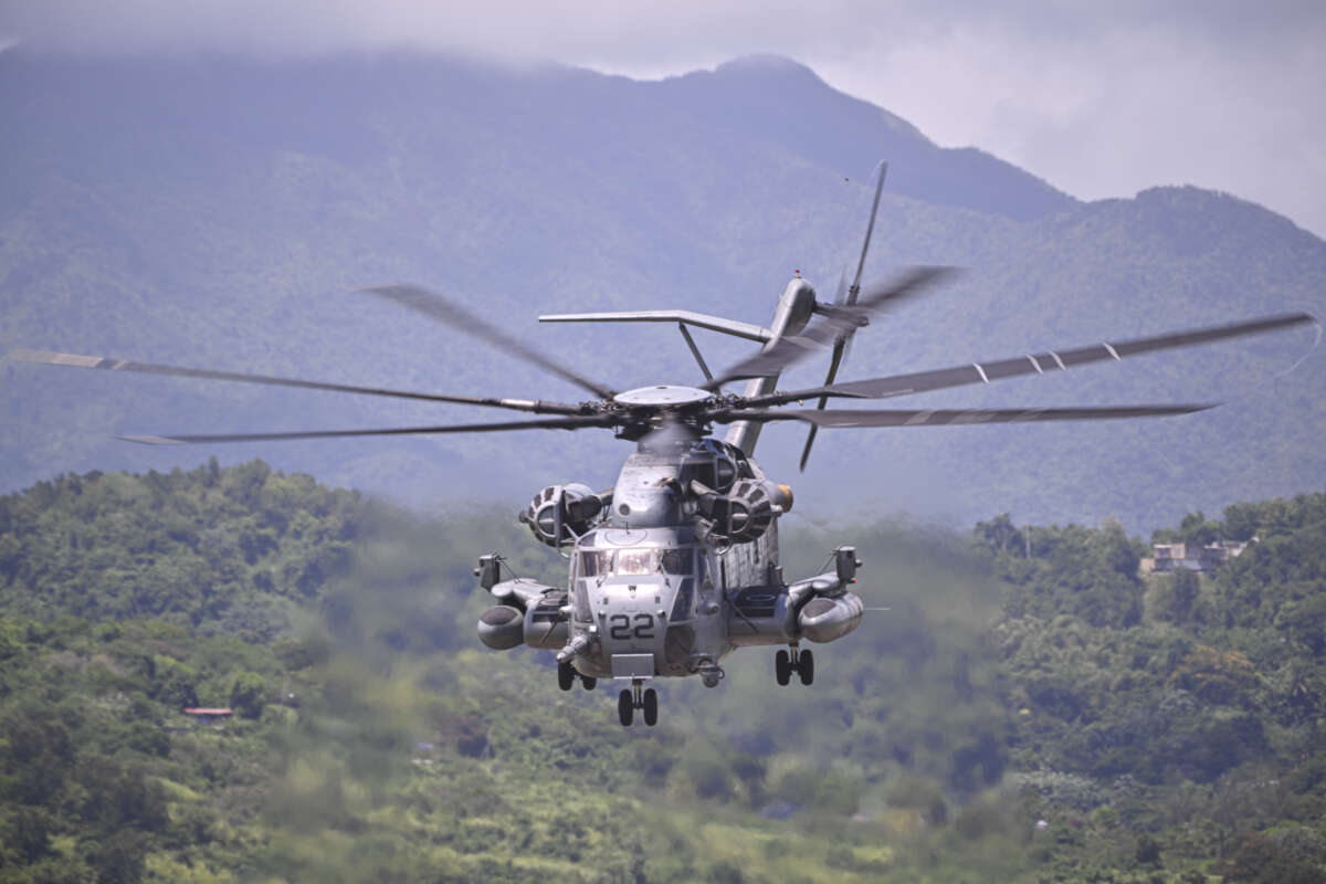 A U.S. Marine Sikorsky CH-53K King Stallion helicopter flies at José Aponte de la Torre Airport, formerly Roosevelt Roads Naval Station, on September 12, 2025, in Ceiba, Puerto Rico, amid the Trump administration's military buildup in the Caribbean.