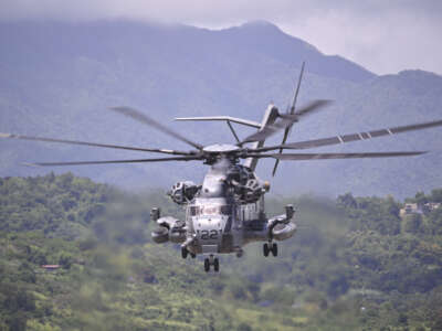 A U.S. Marine Sikorsky CH-53K King Stallion helicopter flies at José Aponte de la Torre Airport, formerly Roosevelt Roads Naval Station, on September 12, 2025, in Ceiba, Puerto Rico, amid the Trump administration's military buildup in the Caribbean.