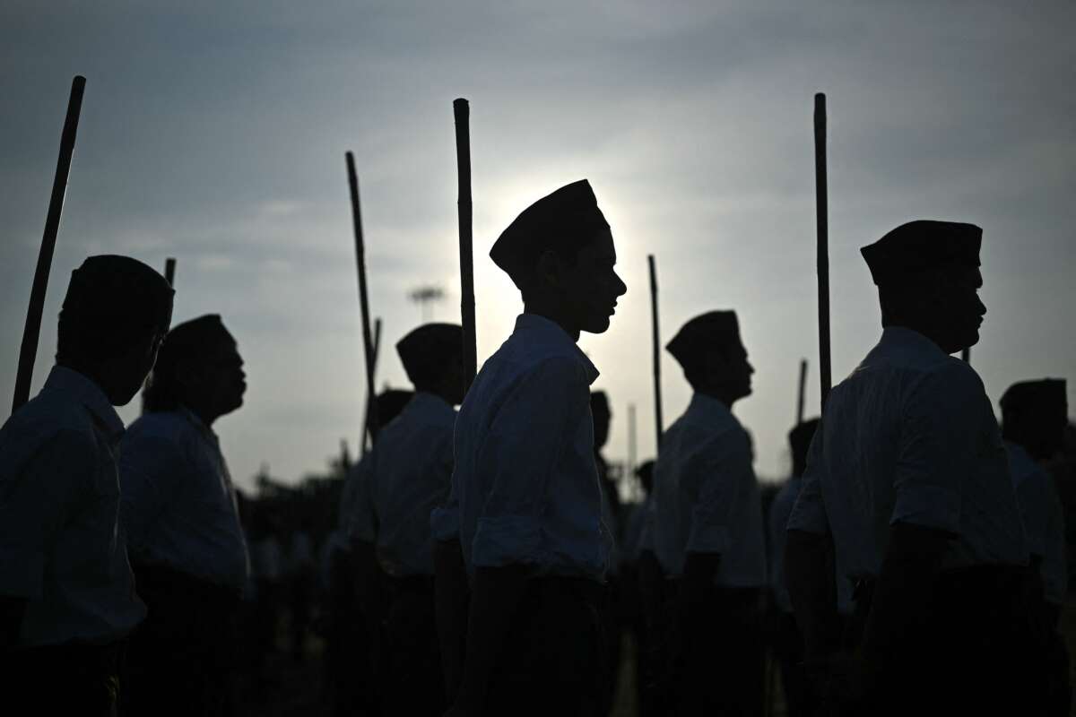 Rashtriya Swayamsevak Sangh volunteers wait to take part in the Hindu nationalist organization's centenary celebrations at Reshimbagh Ground in Nagpur, India, on October 2, 2025.