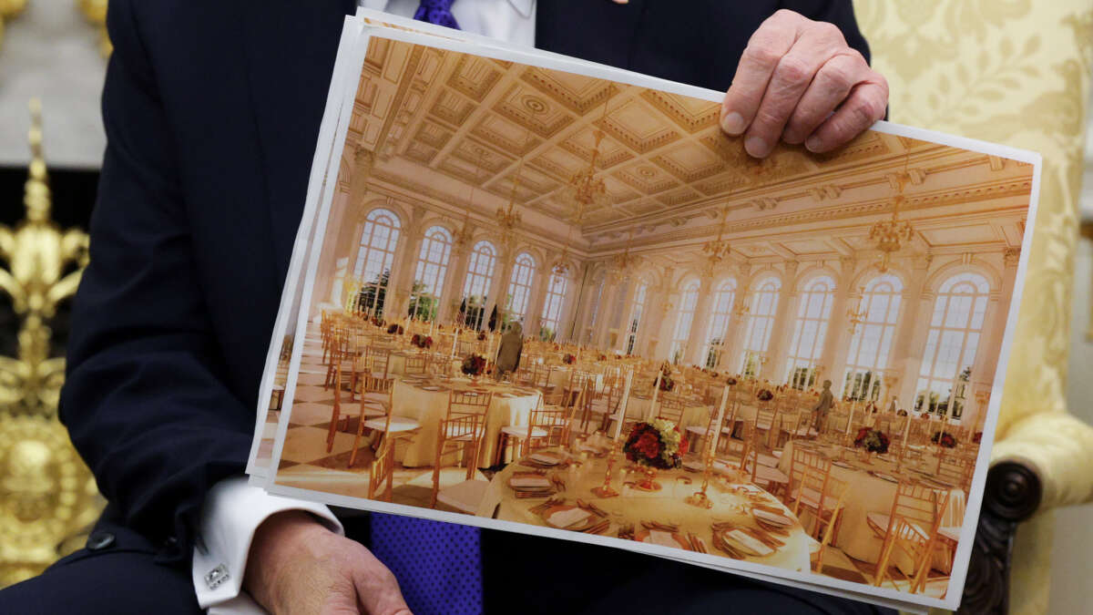 U.S. President Donald Trump displays a rendering of his proposed $250 million White House ballroom as he meets with NATO Secretary General Mark Rutte in the Oval Office of the White House on October 22, 2025, in Washington, D.C.