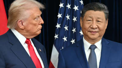 U.S. President Donald Trump and China's President Xi Jinping arrive for talks at the Gimhae Air Base on October 30, 2025.