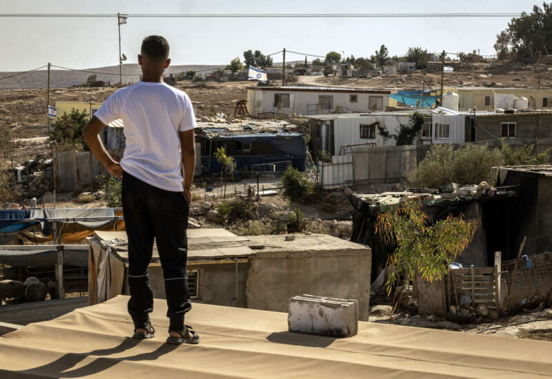 A Palestinian man looks at an Israeli settlement from his village of Umm al-Khair in the occupied West Bank, Palestine, on November 2, 2025. Like other communities in the area, the approximately 200 residents of Umm al-Khair are descendants of Bedouins expelled from the Negev desert in southern Israel in the early 1950s.