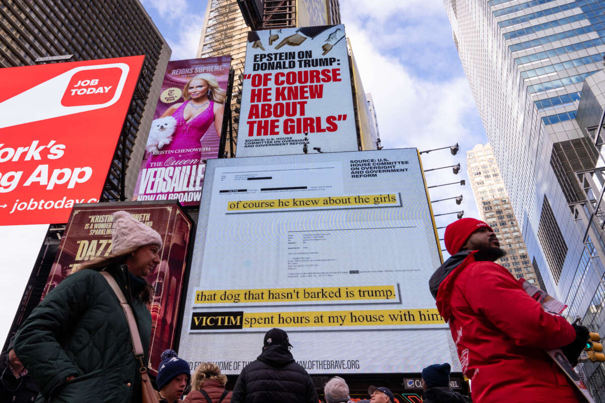 A billboard in Times Square, paid for by the group Home of the Brave, highlights Jeffrey Epstein's comment that Donald Trump "of course he knew about the girls.", on November 17, 2025, in New York City.