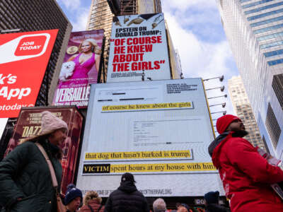 A billboard in Times Square, paid for by the group Home of the Brave, highlights Jeffrey Epstein's comment that Donald Trump "of course he knew about the girls.", on November 17, 2025, in New York City.
