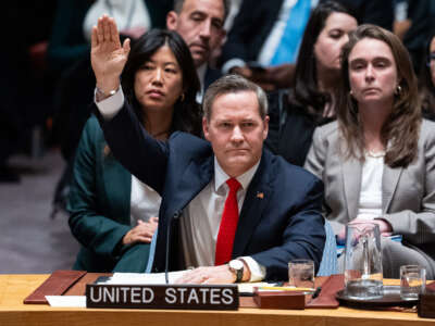 U.S. Ambassador to the United Nations Mike Waltz raises his hand to vote in favor of a draft resolution to authorize an International Stabilization Force in Gaza, on November 17, 2025, in New York City.