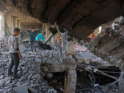 Palestinian children inspect the debris of a damaged building belonging to the Ministry of Religious Endowments, which was sheltering displaced people in the Zeitoun neighborhood of Gaza City, on November 20, 2025, a day after it was targeted by Israeli army.