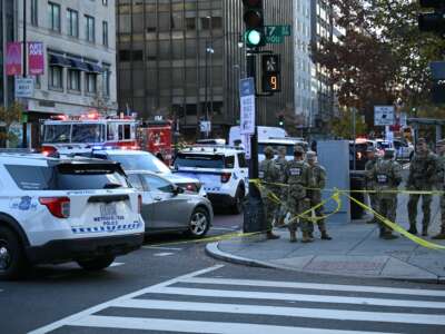 National Guard soldiers gather near the scene of a shooting in downtown Washington, D.C., on November 26, 2025.