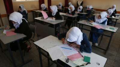 Palestinian high school students take their final exams in Gaza City on June 3, 2017.