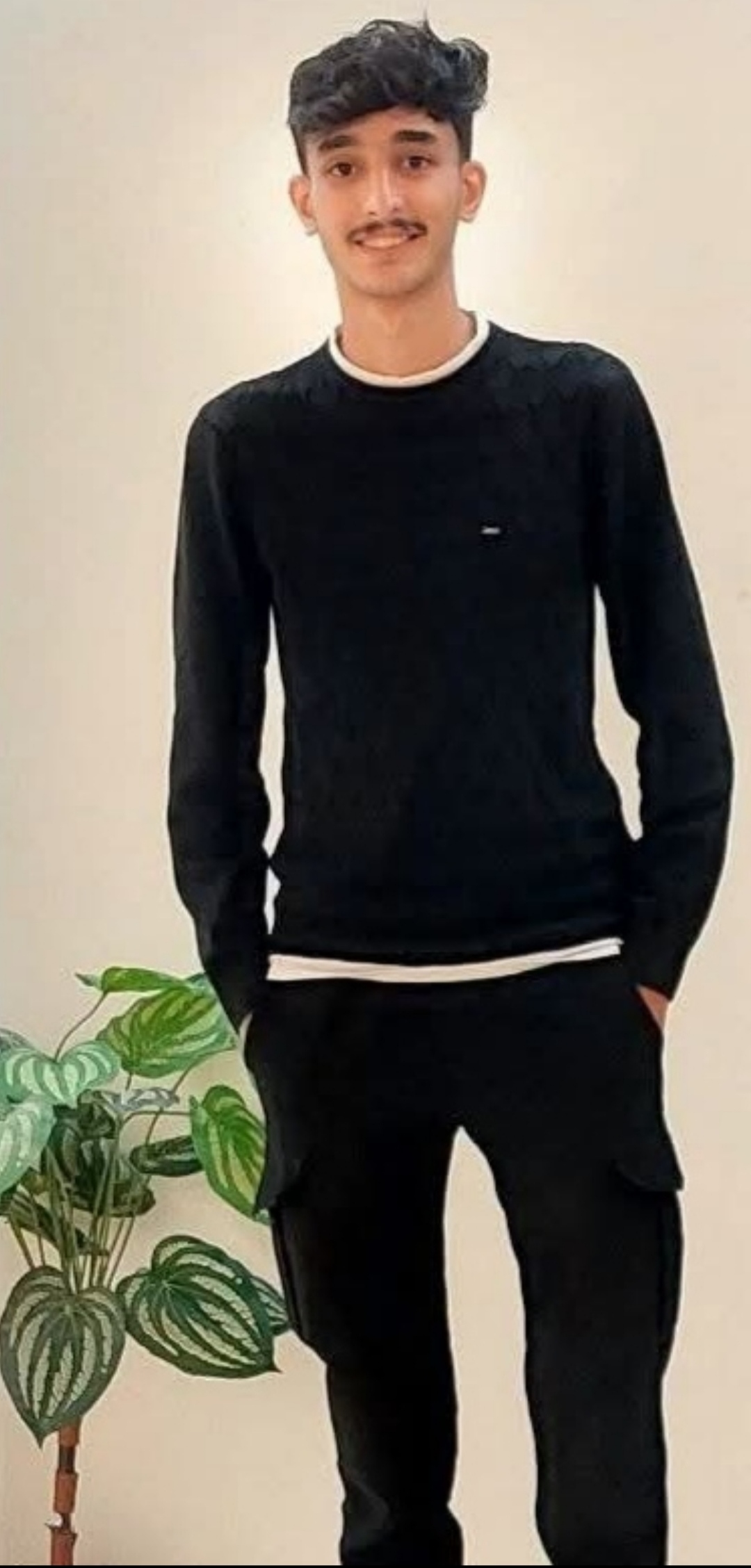 The author’s brother, Mohammed Abu Muaileq, poses for a photo at home in Gaza on October 14, 2025, right after he received his high school exam results.