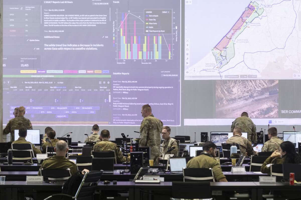 U.S. Army personnel, IDF personnel and others international officials monitor screens displaying maps and imagery of the Gaza Strip during a media tour inside the Civil-Military Coordination Center (CMCC) on November 20, 2025 in Kiryat Gat, Israel.
