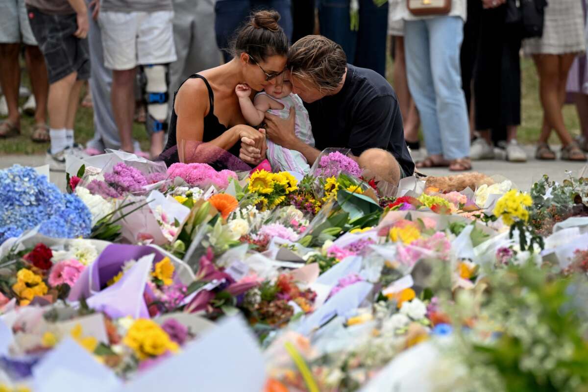 Mourners pay a floral tribute to Bondi Beach shooting victims at the Bondi Pavilion in Sydney on December 15, 2025.