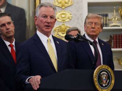Sen. Tommy Tuberville speaks as President Donald Trump looks on in the Oval Office at the White House on September 2, 2025 in Washington, D.C.