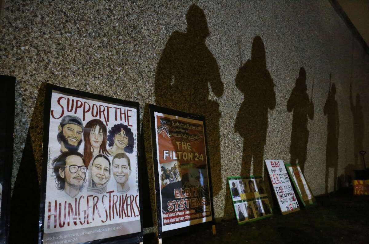 Protesters’ shadows are projected onto the prison walls above placards in support of the hunger strikers. Supporters of the Filton 24, a group of pro-Palestine activists, rallied outside HMP Peterborough in solidarity with the 24 prisoners on remand and the six currently on hunger strike in prisons across the U.K.