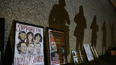 Protesters’ shadows are projected onto the prison walls above placards in support of the hunger strikers. Supporters of the Filton 24, a group of pro-Palestine activists, rallied outside HMP Peterborough in solidarity with the 24 prisoners on remand and the six currently on hunger strike in prisons across the U.K.