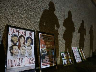 Protesters’ shadows are projected onto the prison walls above placards in support of the hunger strikers. Supporters of the Filton 24, a group of pro-Palestine activists, rallied outside HMP Peterborough in solidarity with the 24 prisoners on remand and the six currently on hunger strike in prisons across the U.K.